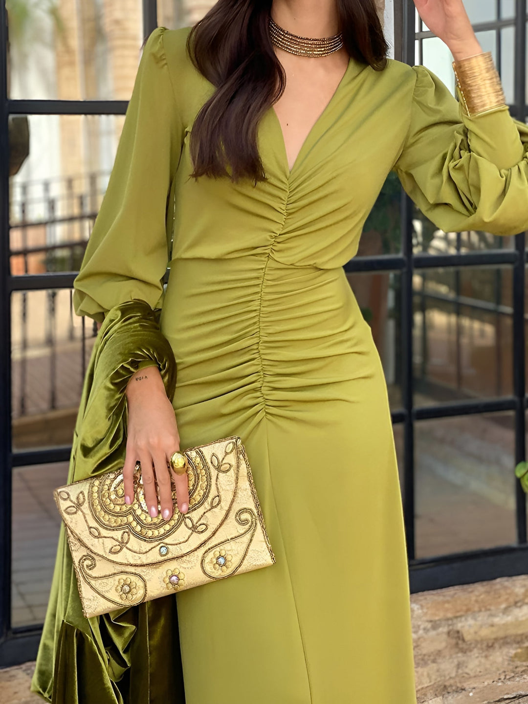 Women's formal wear: Long sleeve V-neck high-low ruched maxi dress. Elegant and sophisticated style.