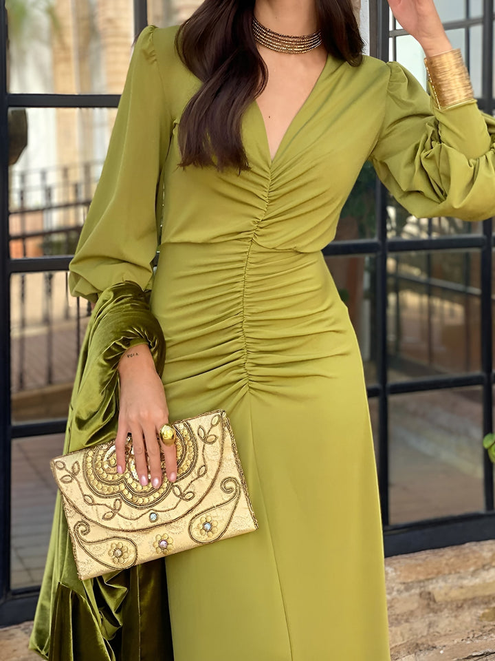 Women's formal wear: Long sleeve V-neck high-low ruched maxi dress. Elegant and sophisticated style.
