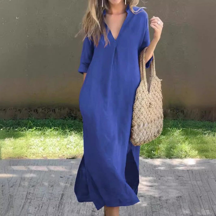 Flowy V-neck sleeveless maxi dress for women, featuring a comfortable design and chic thigh slit, ideal for summer.