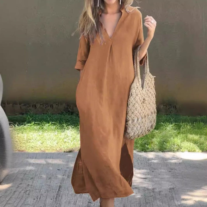 Fashionable women's summer maxi dress with V-neck and elegant thigh slit, versatile for casual outings or parties.