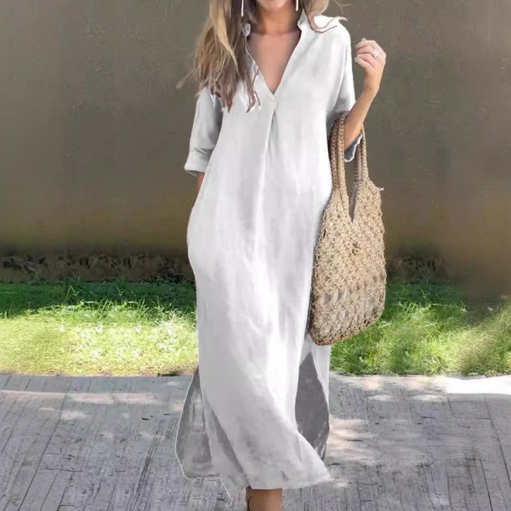 Stylish women's V-neck long summer dress, sleeveless with a graceful thigh slit, offering a comfortable and elegant look.