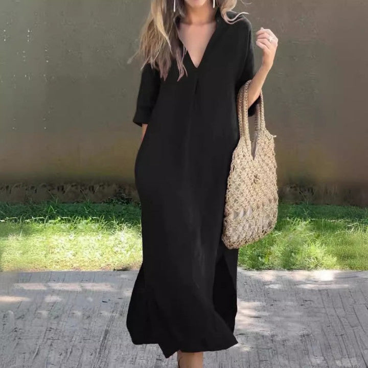 Lightweight women's V-neck maxi summer dress with a flowy silhouette and thigh slit, great for vacation fashion.