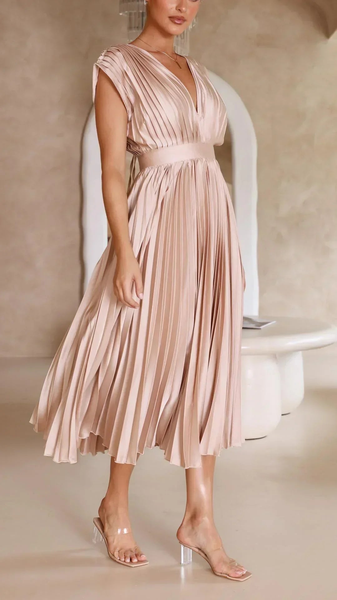 Modern & stylish women's V-neck dress with a trendy adjustable tie back, ideal for fashion-forward women.