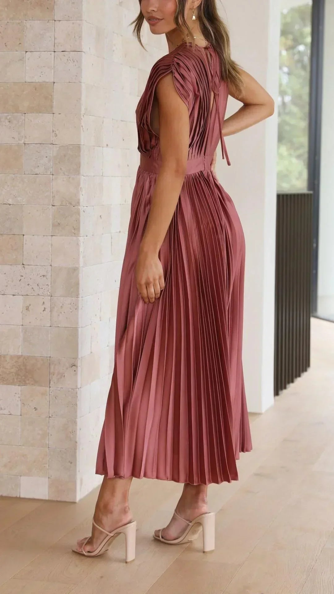 Simple & elegant women's V-neck dress with a functional adjustable tie back, great for any occasion.