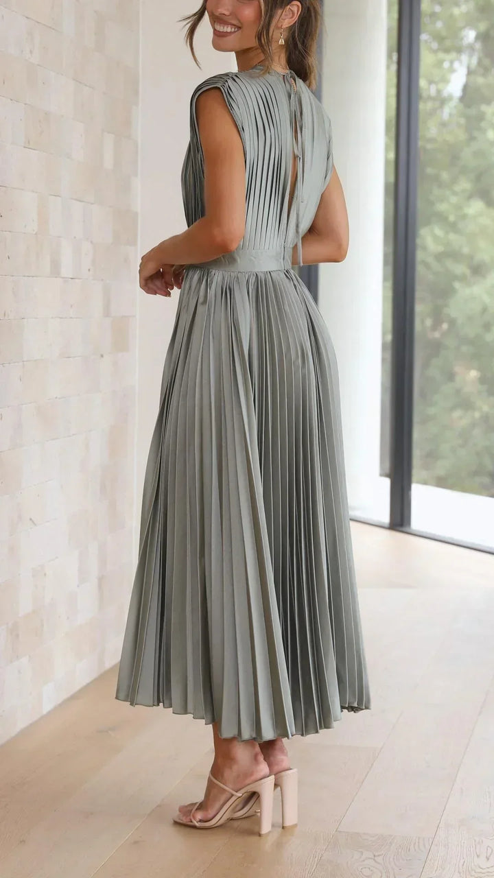 Casual yet elegant women's V-neck summer dress with a stylish adjustable tie back design. Midi length.