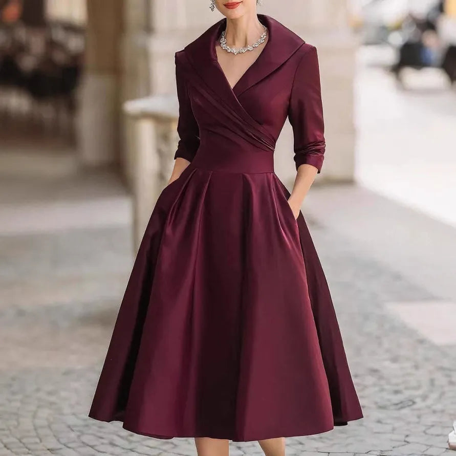 Chic ladies' V-neck three-quarter sleeve midi dress, a stylish and comfortable choice for various events.