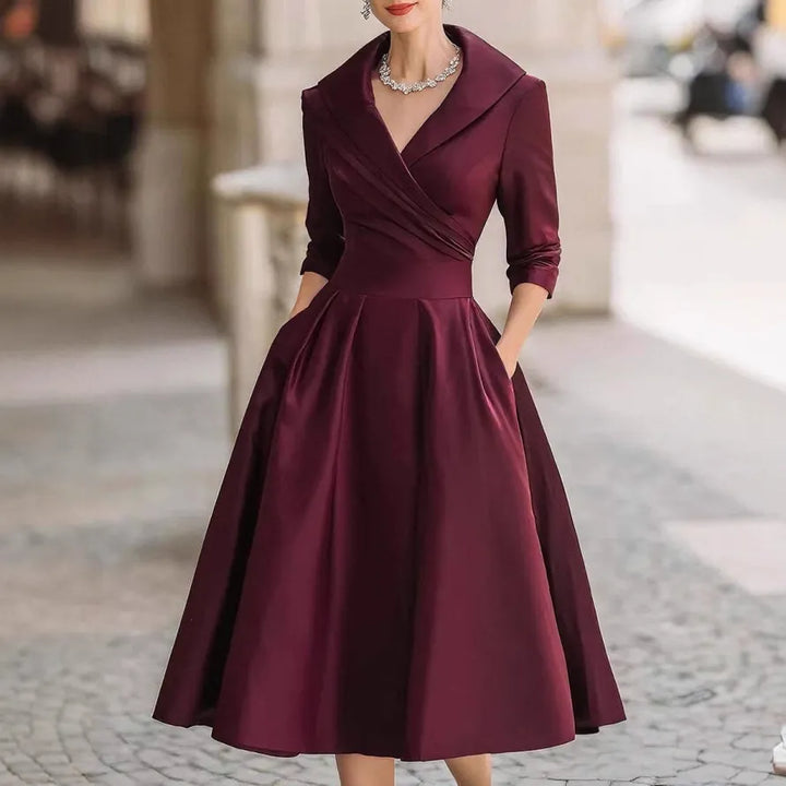 Chic ladies' V-neck three-quarter sleeve midi dress, a stylish and comfortable choice for various events.