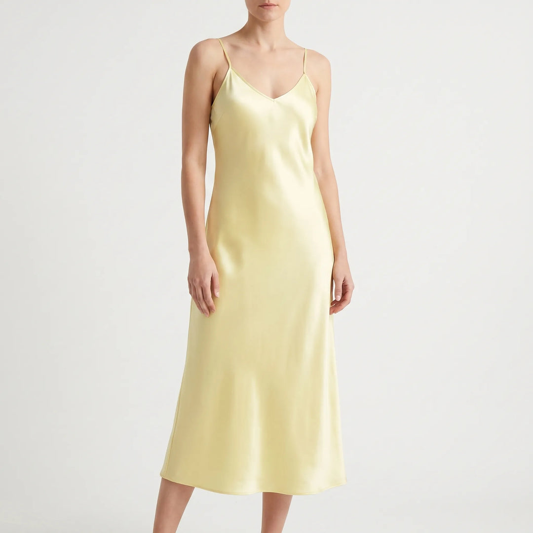 Chic solid color spaghetti strap slip dress for women. Elegant V-neck design, comfortable and versatile.