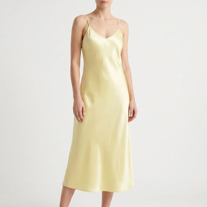 Chic solid color spaghetti strap slip dress for women. Elegant V-neck design, comfortable and versatile.