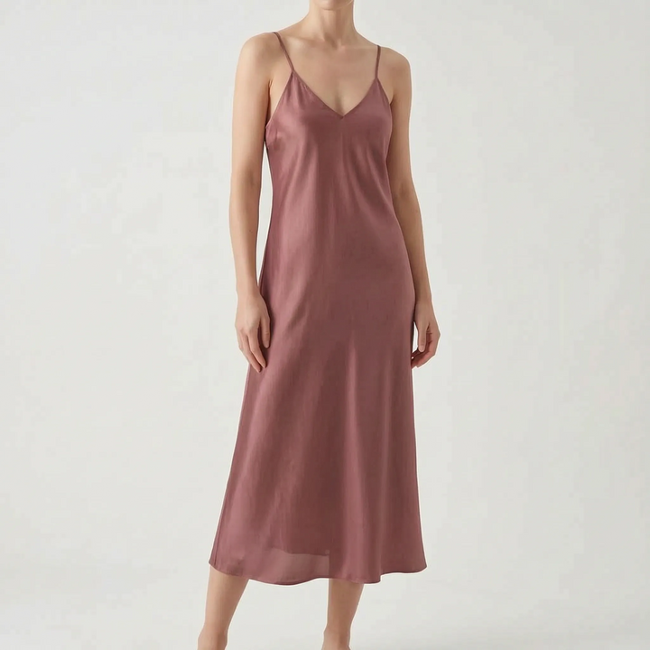 Solid color elegant V-neck slip dress for women. Midi length with delicate spaghetti straps for chic fashion.