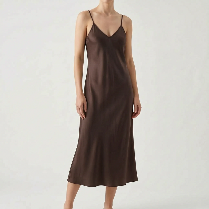 Elegant women's V-neck spaghetti strap slip midi dress in a solid color. Chic, comfortable, and versatile fashion.