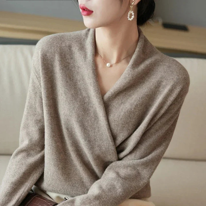 Cozy knit women's V-neck pullover sweater, a comfortable and versatile layering piece for chic fall/winter fashion.