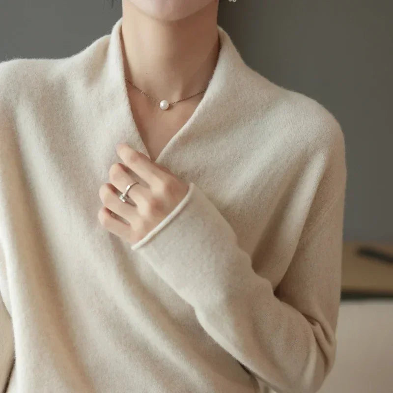 Versatile women's V-neck pullover sweater, an elegant layering piece for comfortable and chic fall/winter fashion.