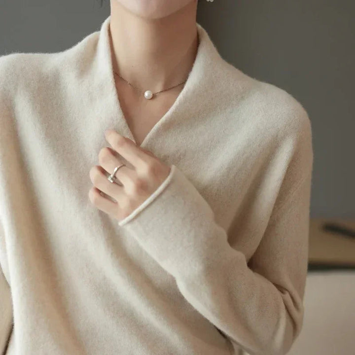 Versatile women's V-neck pullover sweater, an elegant layering piece for comfortable and chic fall/winter fashion.