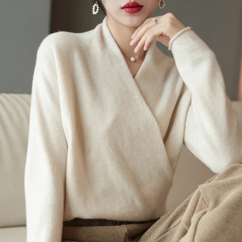 Stylish women's V-neck pullover sweater featuring a comfortable cozy knit, perfect for elegant fall/winter wear.