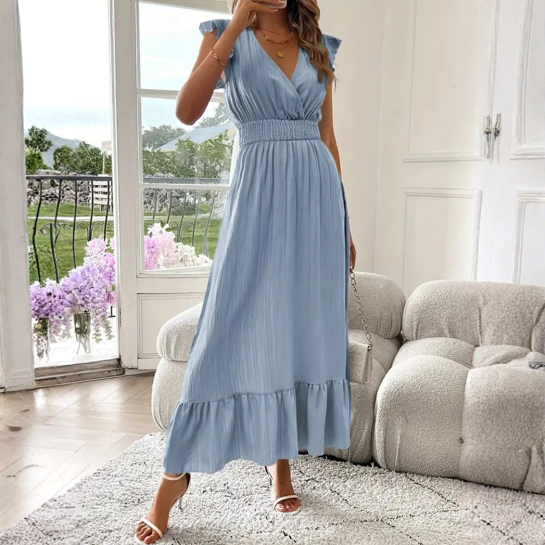 Chic women's V-neck maxi dress, featuring delicate ruffle trim. Great for elegant daytime or evening looks.