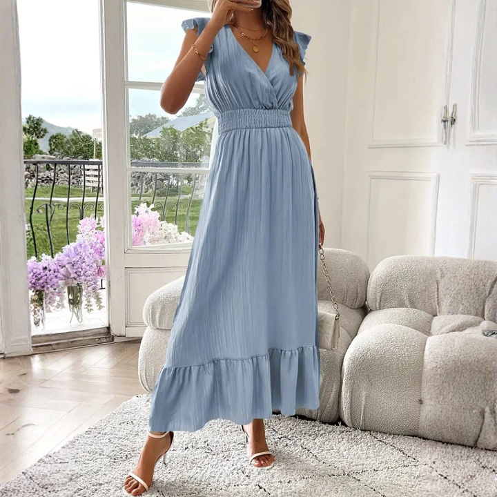 Chic women's V-neck maxi dress, featuring delicate ruffle trim. Great for elegant daytime or evening looks.