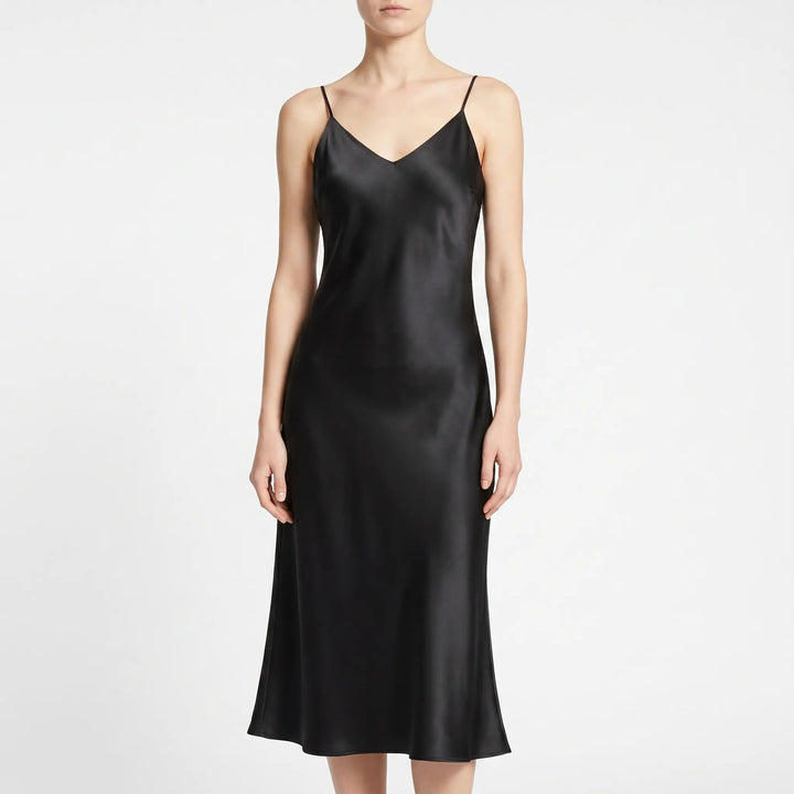 Chic women's flowy A-line midi slip dress with spaghetti straps, ideal for cocktails & summer evenings.