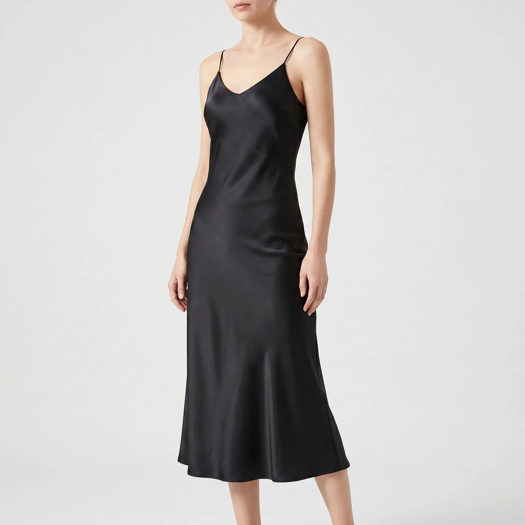 Modern chic women's flowy V-neck midi slip dress, ideal for a stylish party look or elegant summer outfit.