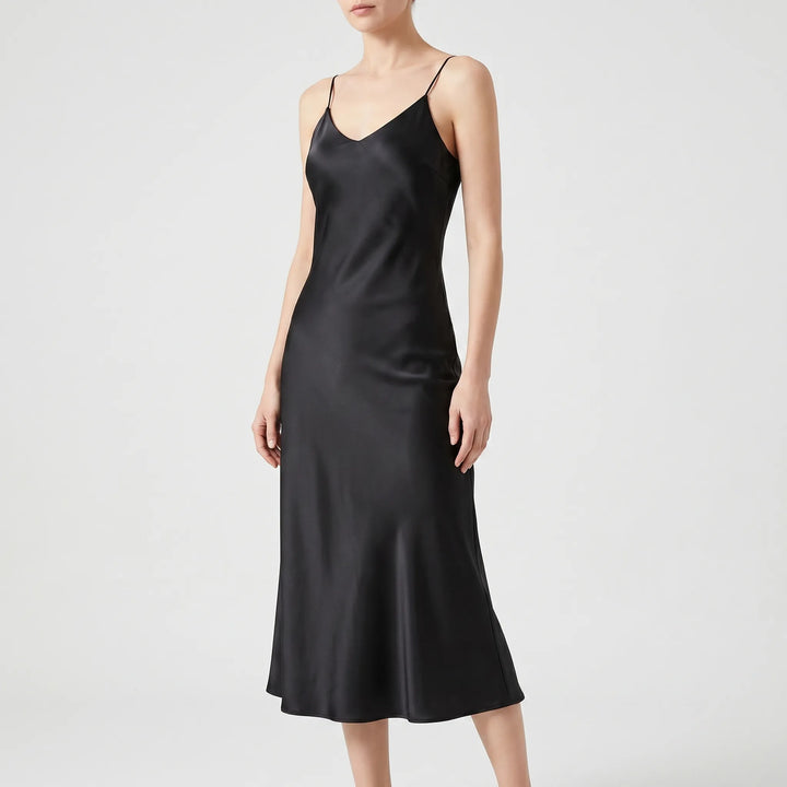 Modern chic women's flowy V-neck midi slip dress, ideal for a stylish party look or elegant summer outfit.