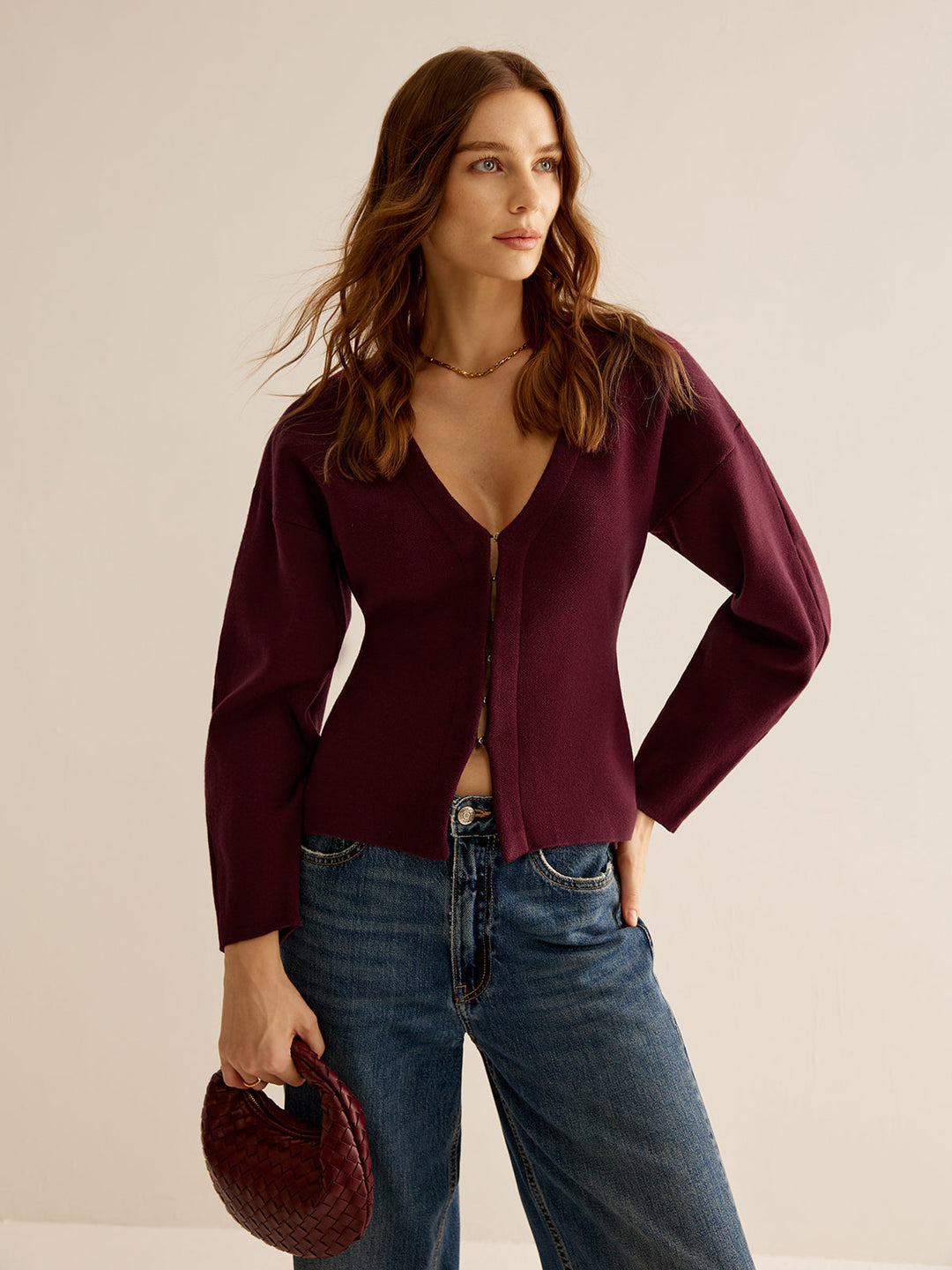 Elegant women's V-neck sweater, slim fit for professional style. Comfortable long-sleeve business casual top.
