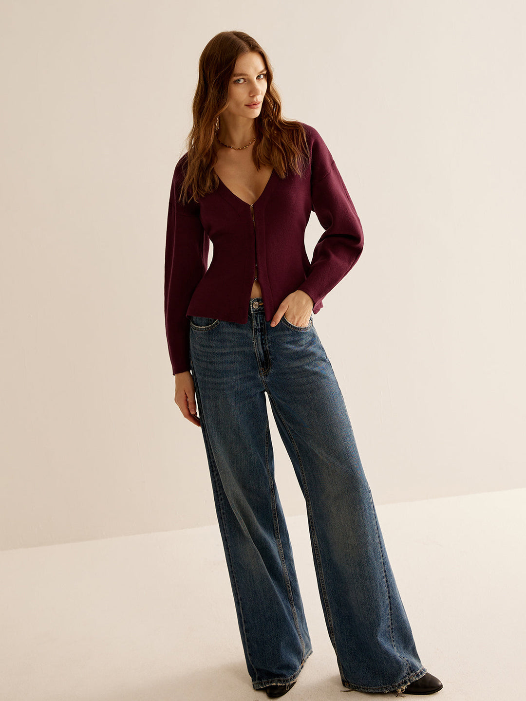 Stylish women's V-neck sweater, slim fit long sleeve. Elegant and comfortable for professional attire.