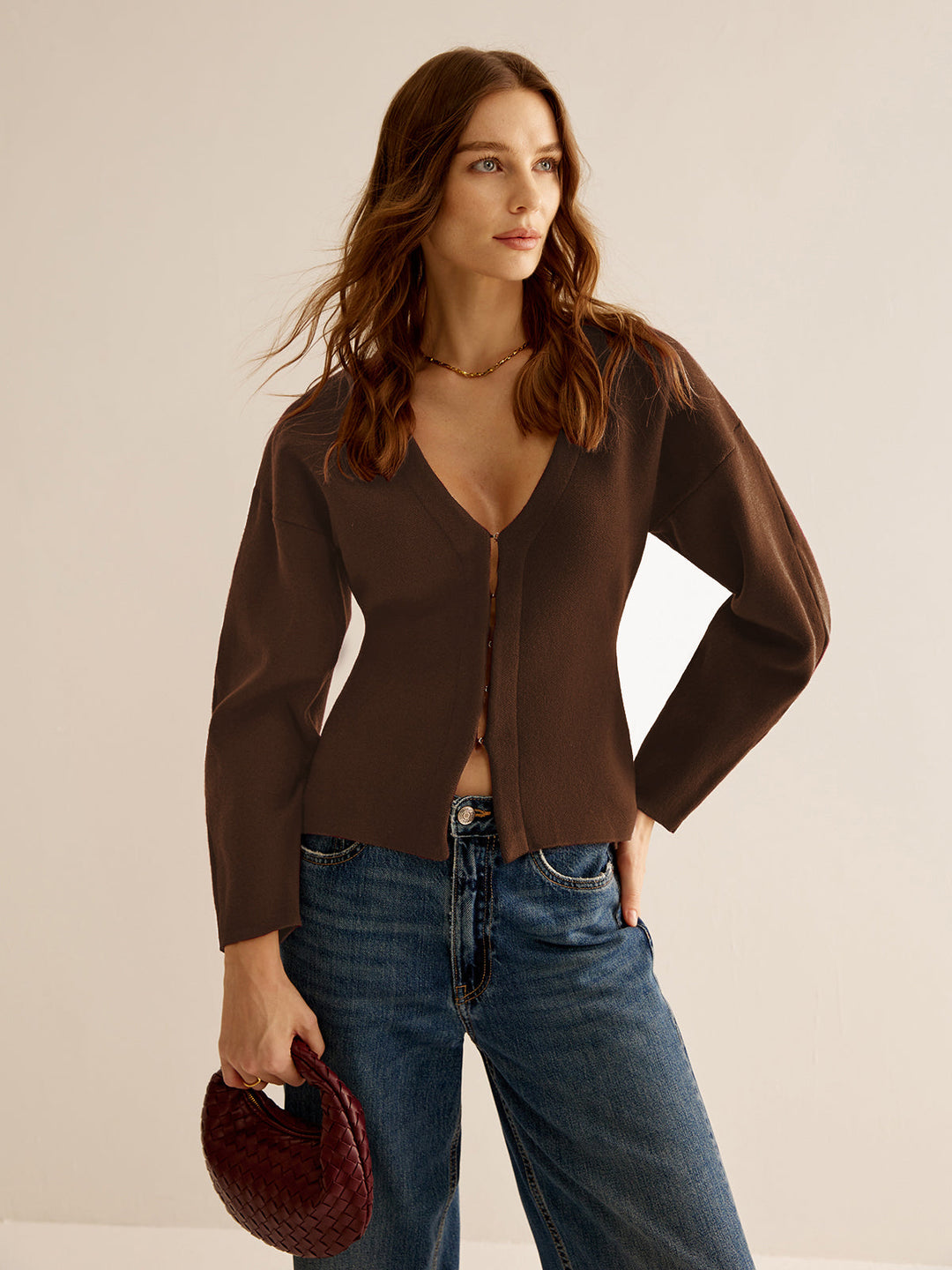 Comfortable women's V-neck sweater, elegant slim fit long sleeve. Modern professional and business casual.