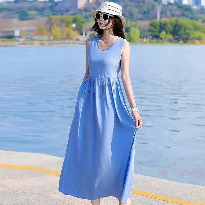 Casual yet elegant V-neck maxi dress with tie waist and pockets, perfect for warm weather style.