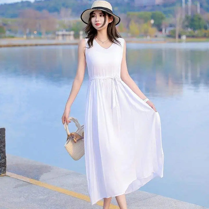 Lightweight flowy summer maxi dress with V-neck, tie waist, and pockets for ultimate comfort.