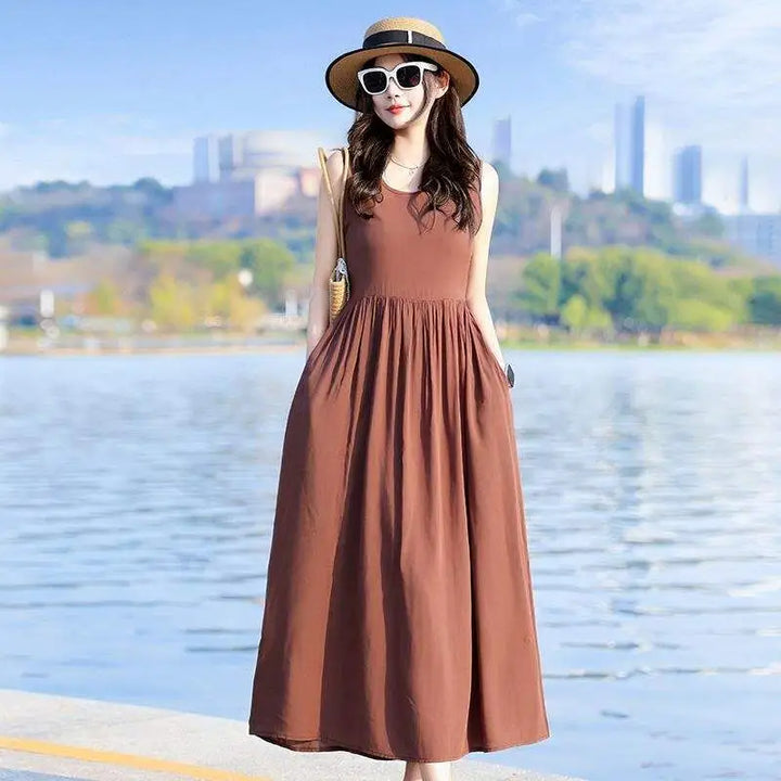 Stylish V-neck tie waist maxi dress with functional pockets. Comfortable & elegant summer wear.