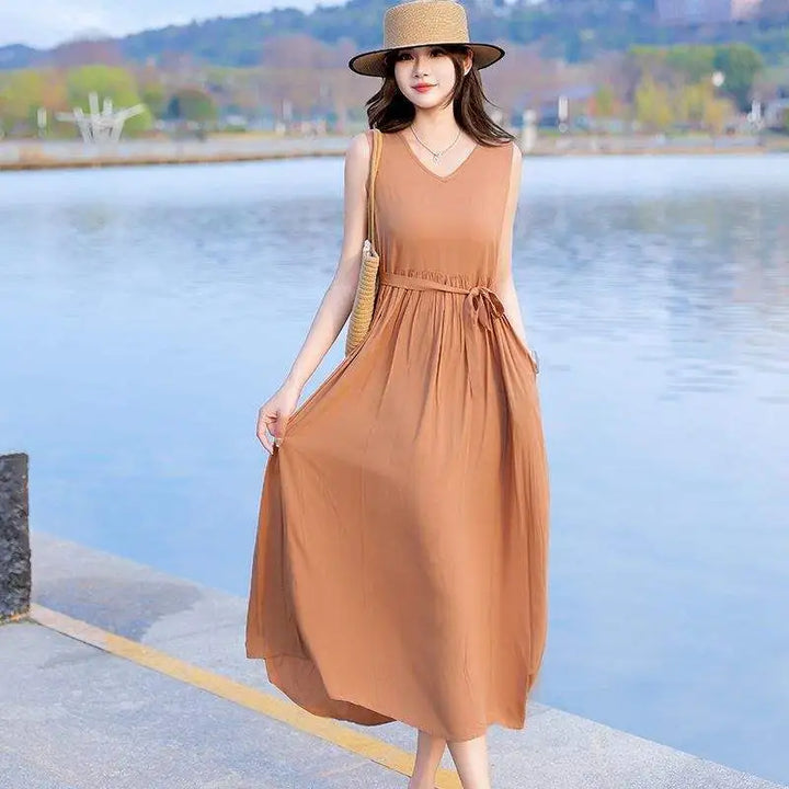 Comfortable women's summer maxi dress with a flattering V-neck, tie waist, and practical pockets.