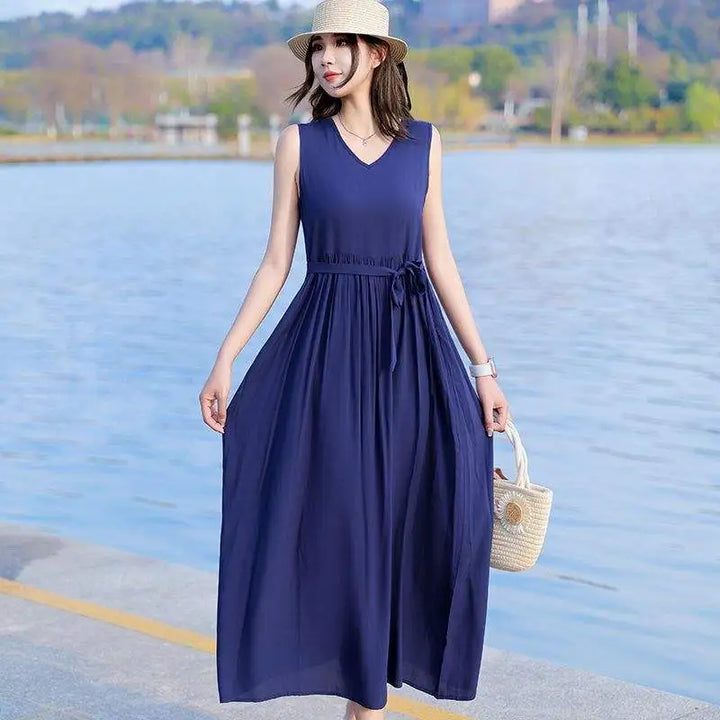 Plus size V-neck tie waist maxi dress with pockets, offering an elegant and comfortable fit for women.