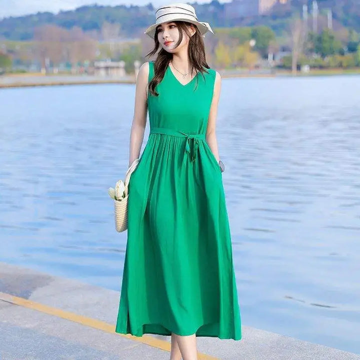 Front view of a versatile V-neck tie waist maxi dress for women, featuring convenient side pockets.