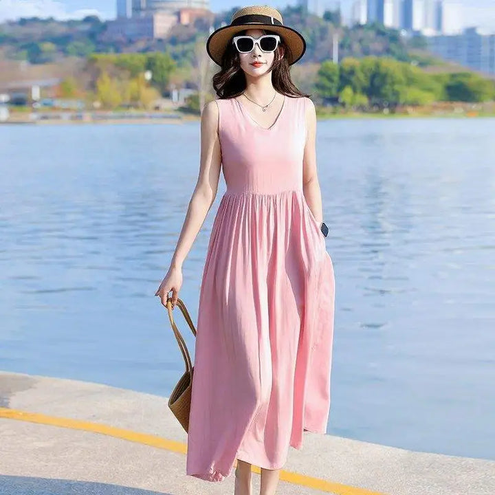 Close-up of the stylish tie-waist detail & practical pockets on a women's V-neck maxi dress.