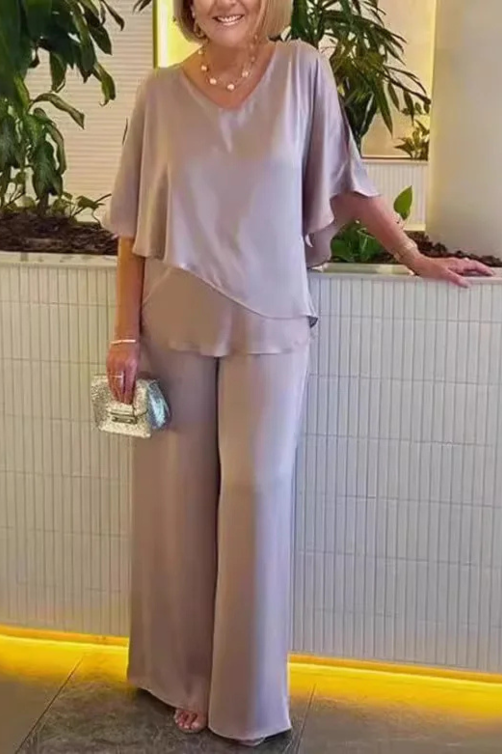 Blue women's V-neck two-piece set, elegant batwing top & wide leg pants. Comfortable outfit.