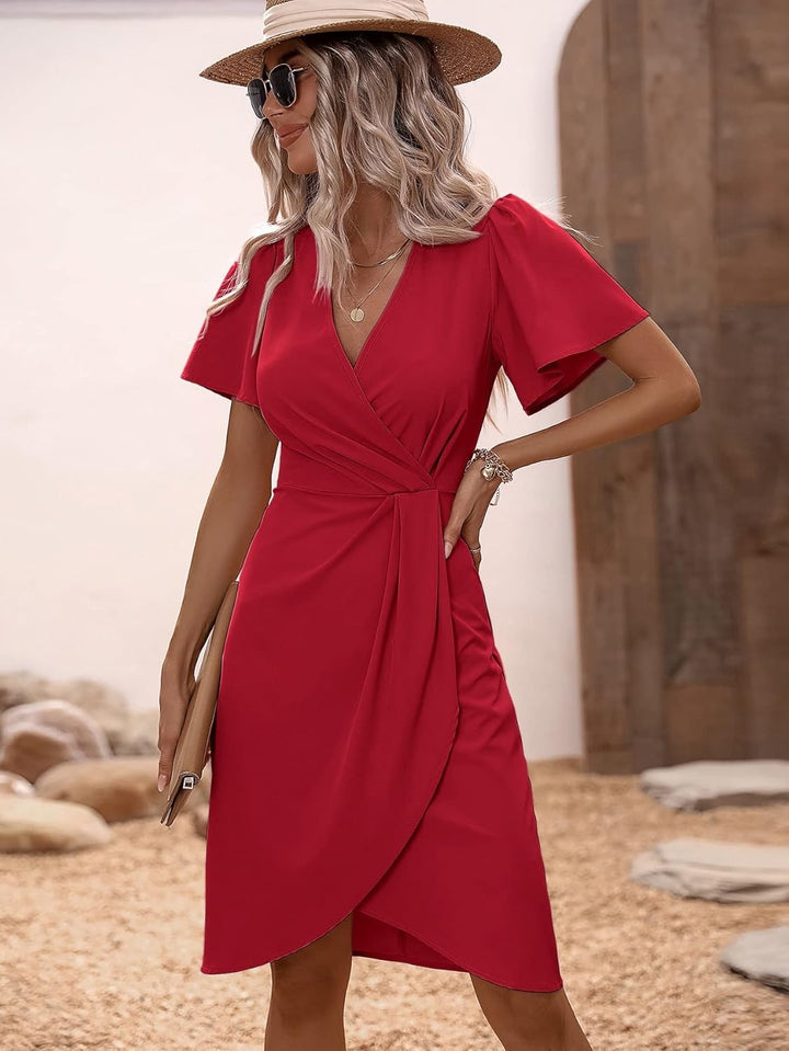 Close-up: Flattering V-neck wrap dress detail, elegant design for versatile women's style.