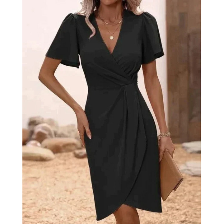 Trendy Serafina wrap dress with V-neck, knee-length design, versatile & flattering.