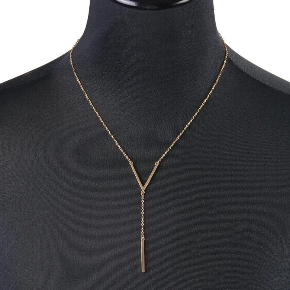 Elegant women's V-shape gold tone necklace. Minimalist stainless steel jewelry for timeless fashion.