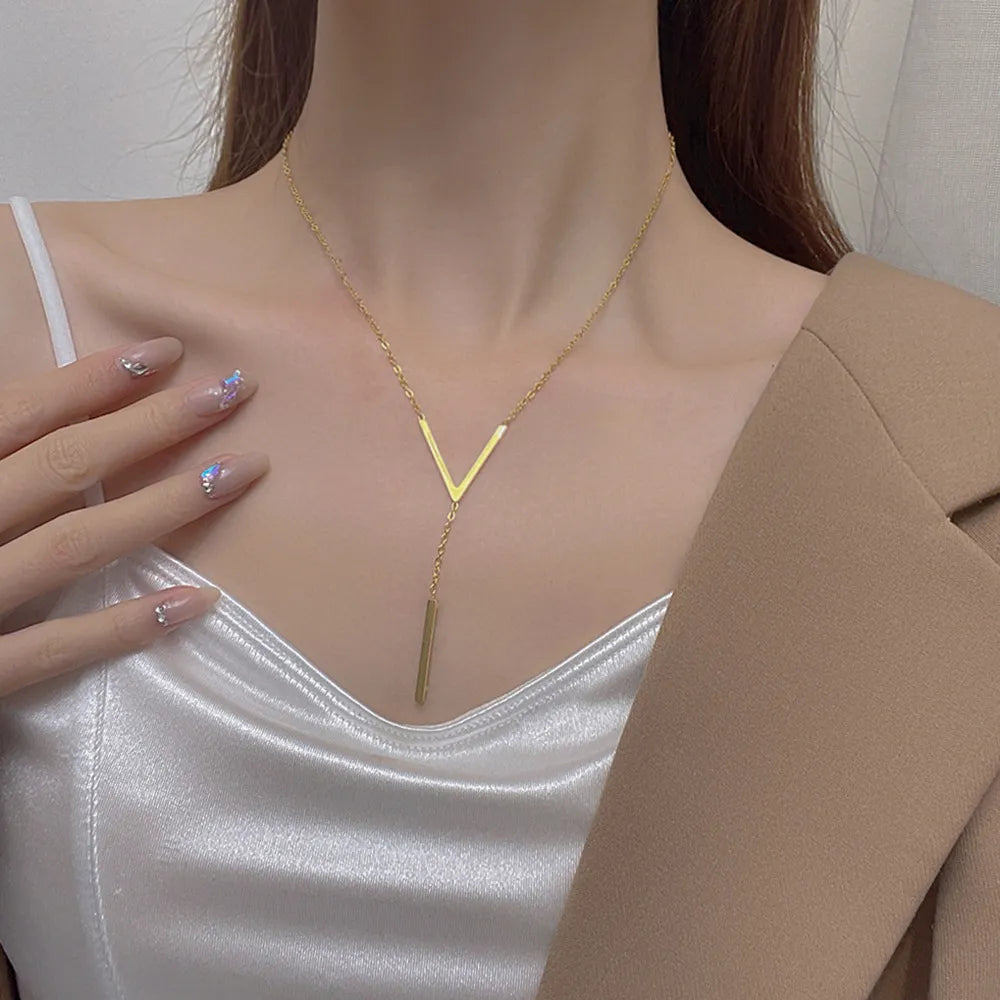 Timeless elegant V-shape gold necklace for women. Perfect minimalist fashion accessory for any outfit.
