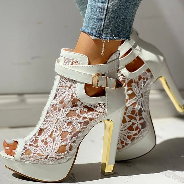 Women's elegant Valencia platform heels complementing a formal evening gown for a special occasion look.