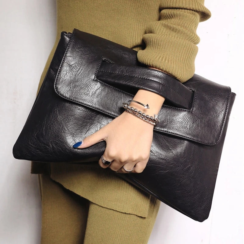 Elegant women's vegan leather handbag with shoulder strap, a chic and versatile fashion accessory.
