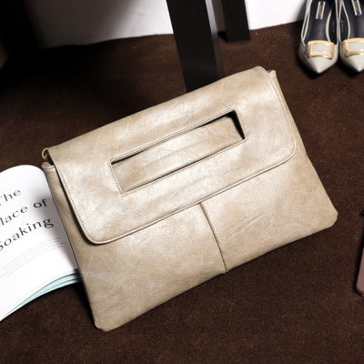 Chic women's handbag crafted from elegant vegan leather, featuring a comfortable shoulder strap.