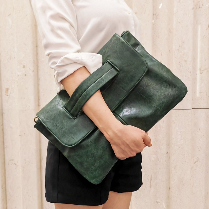 Elegant fashion accessory: a women's vegan leather shoulder bag, also functions as a crossbody.