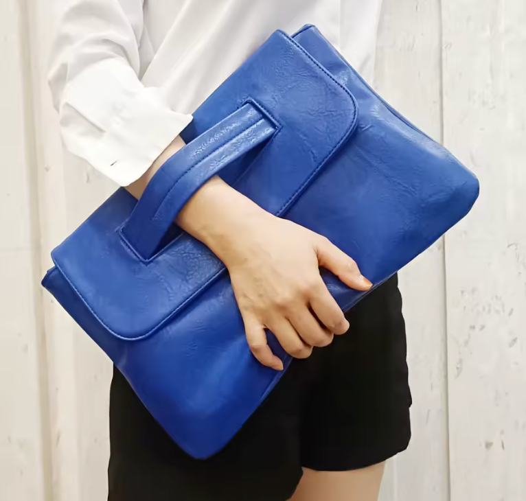 Premium women's vegan leather handbag with a versatile shoulder strap for elegant styling.