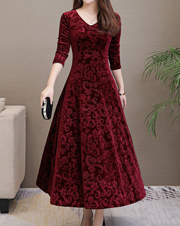 Elegant women's velvet midi dress with long sleeves, perfect for a sophisticated look.