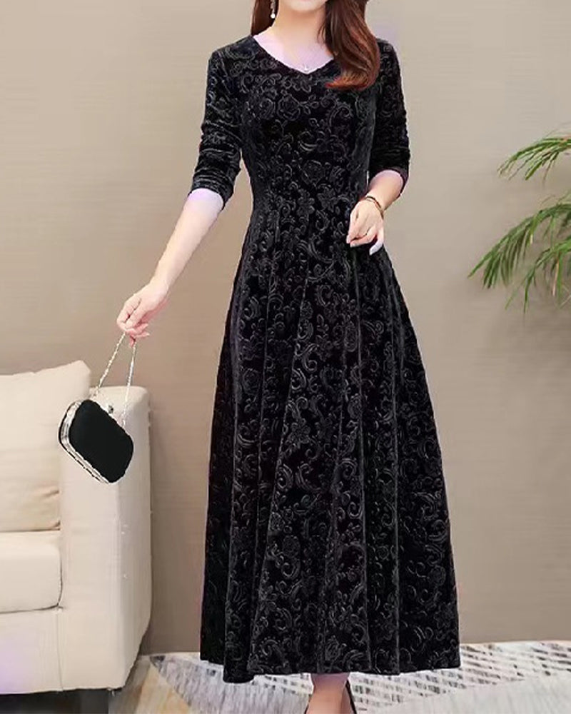 Chic A-line velvet midi dress with long sleeves & a V-neck, great for parties and stylish gatherings.