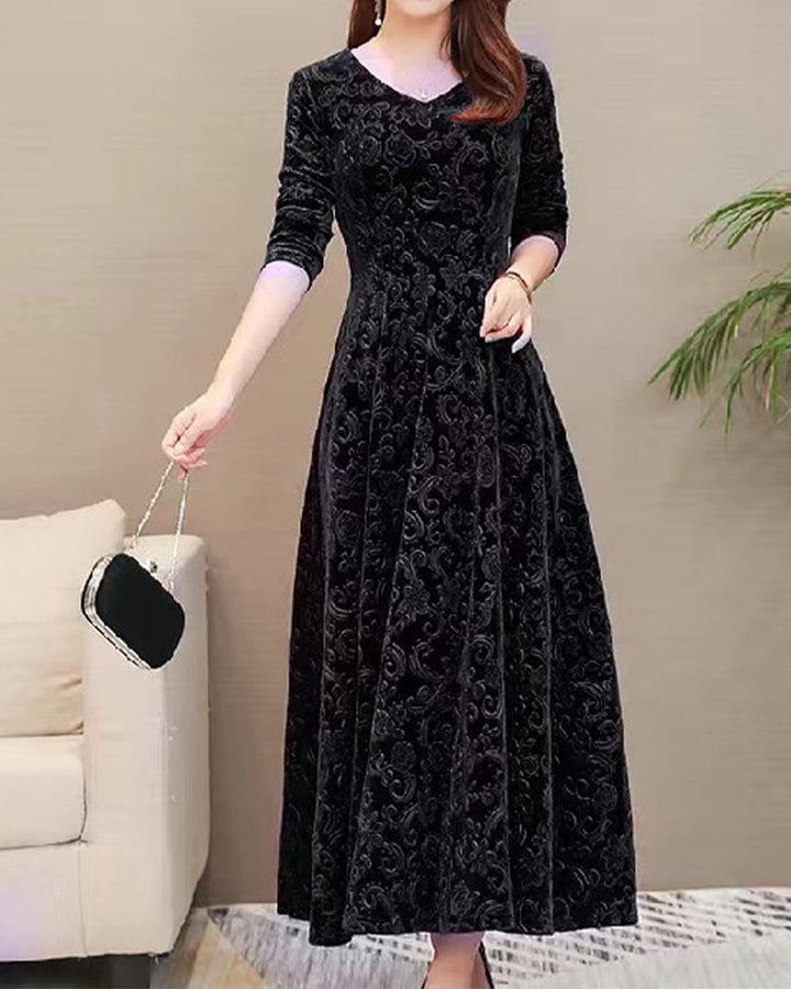 Chic A-line velvet midi dress with long sleeves & a V-neck, great for parties and stylish gatherings.