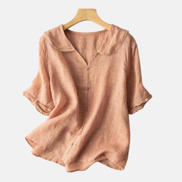 Elegant women's vintage doll collar blouse with short sleeves. Chic top for casual or dressed-up fashion.