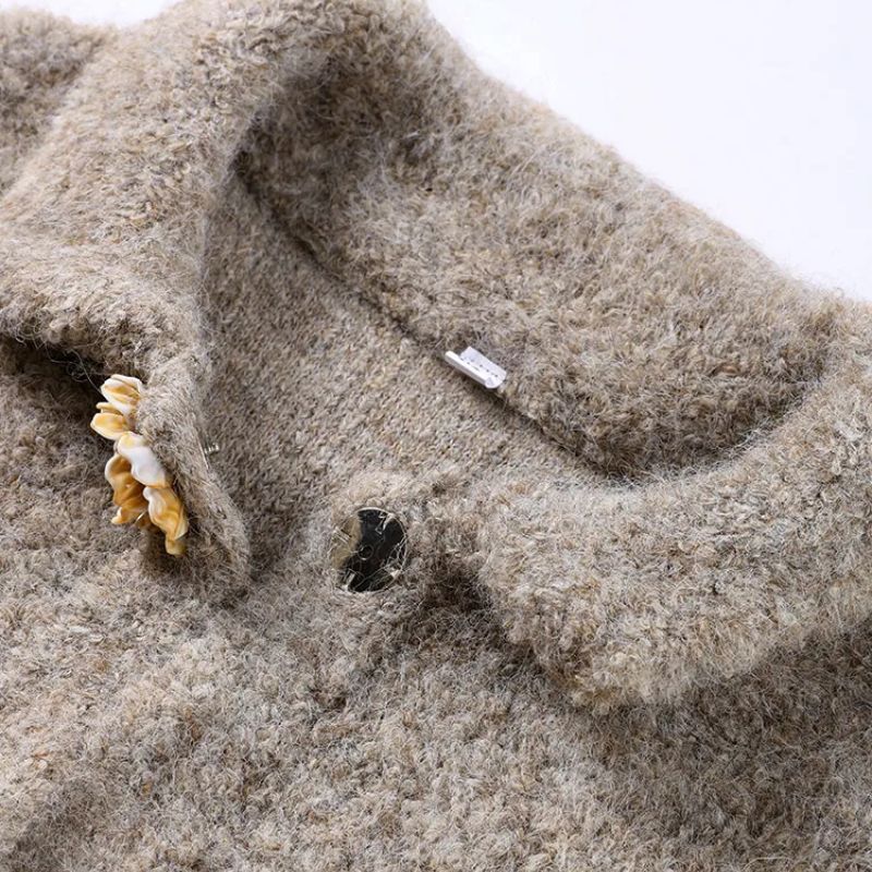 Women's vintage floral button cardigan in a cozy knit. Elegant sweater for fall layering & winter fashion outerwear.