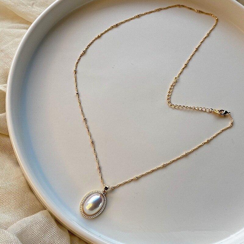 Elegant women's vintage gold pearl necklace. Handcrafted timeless jewelry, perfect gift for her.